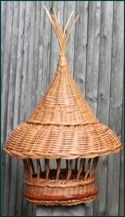 Birdfeeder woven from natural colored reed by master weaver Tina Puckett of Winsted, CT