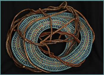 Country Blues, a whimsical wall hanger by master basket weaver Tina Puckett of Winsted, CT