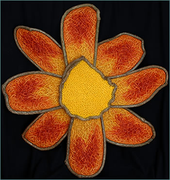 Dahlia is a woven flower sculpture by master basket weaver Tina Puckett of Tina's Baskets in Winsted, CT