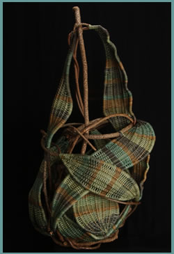 Pear is a free-standing woven sculpture by master basket weaver Tina Puckett
