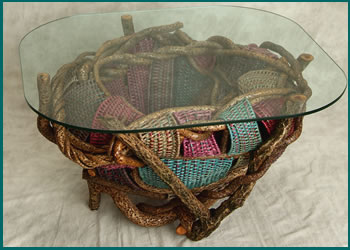 Petals, an end table built and woven by basket artist Tina Puckett of Winsted, CT