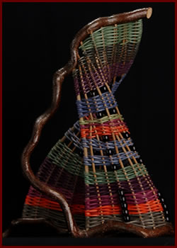 Pitcher is a free-standing sculpture woven by master basket weaver Tina Puckett of Winsted, CT