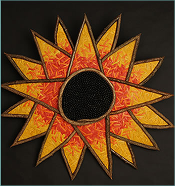 Sunshine Sunflower, a sunflower wall sculpture woven by basketry artist Tina Puckett of Winsted, CT