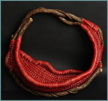 Torch Red, a large pocket wallhanging basket by master weaver Tina Puckett